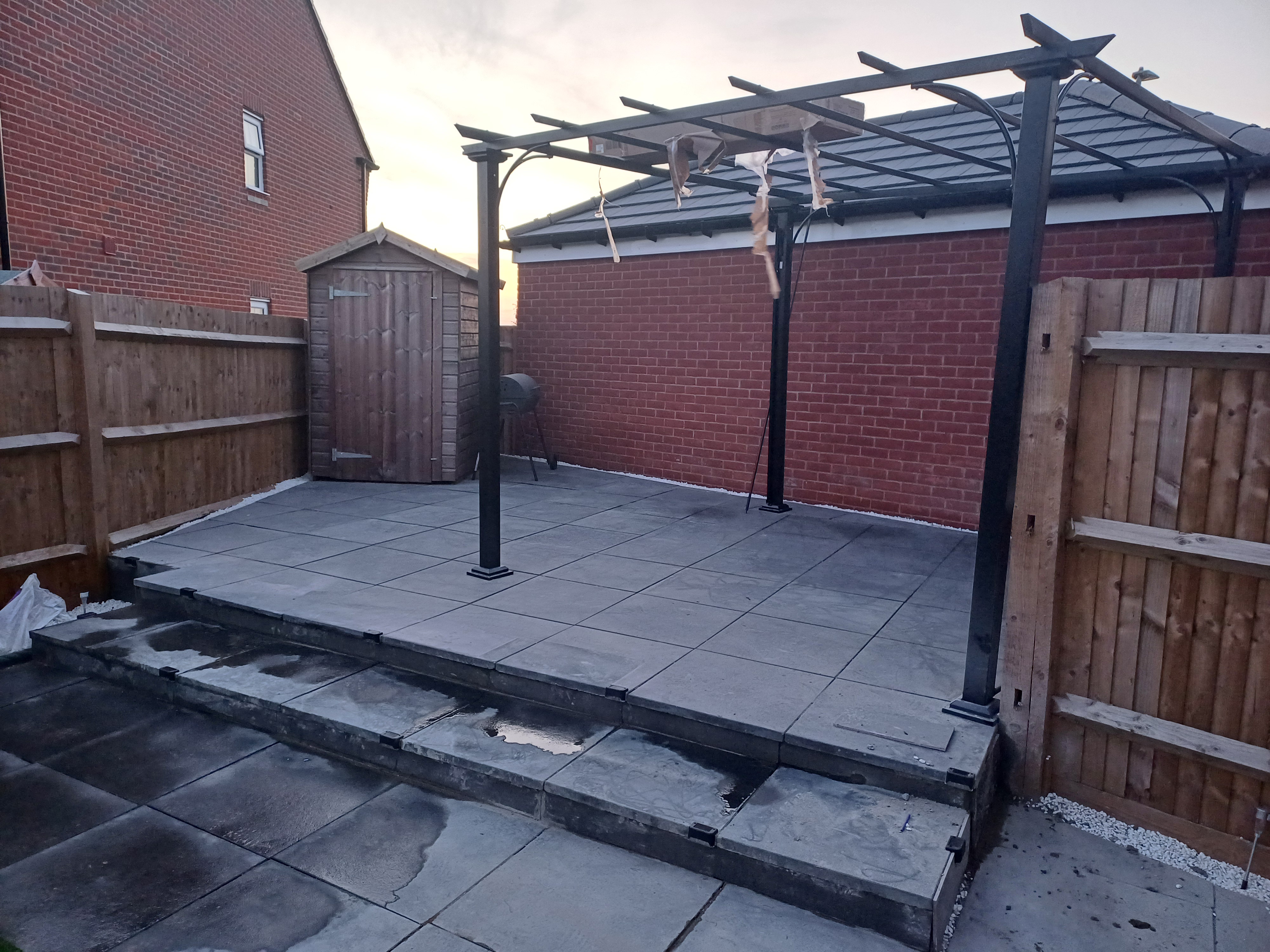 New patio with raised pergola installed in Oxfordshire — landscaping project by JP Garden Maintenance