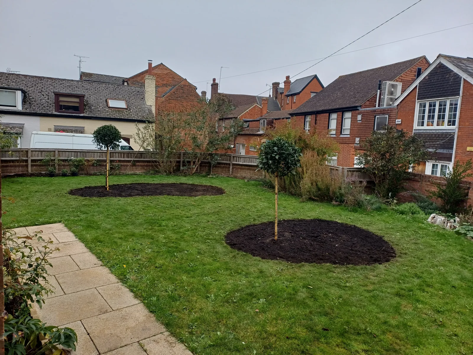 Freshly planted border with new shrubs and flowers installed by JP Garden Maintenance in Oxfordshire